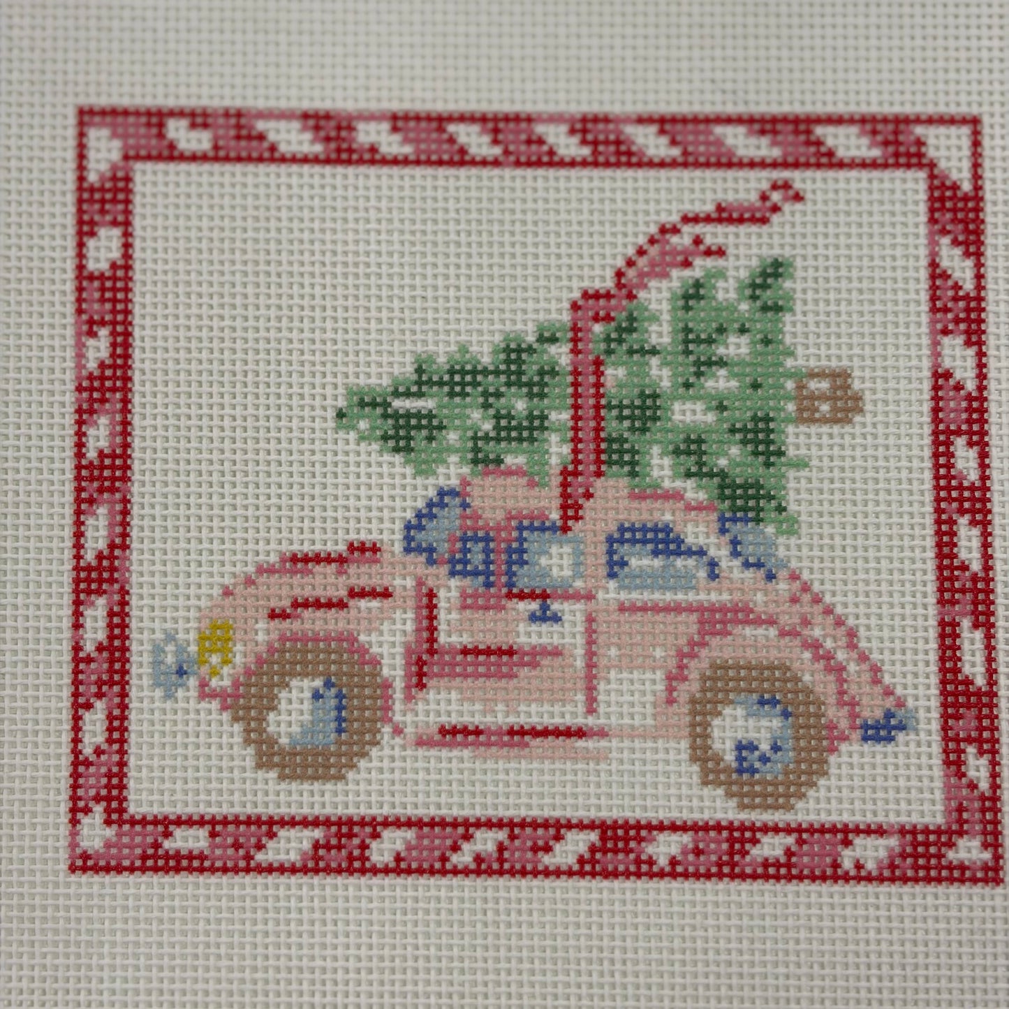 PINK CAR WITH CHRISTMAS TREE