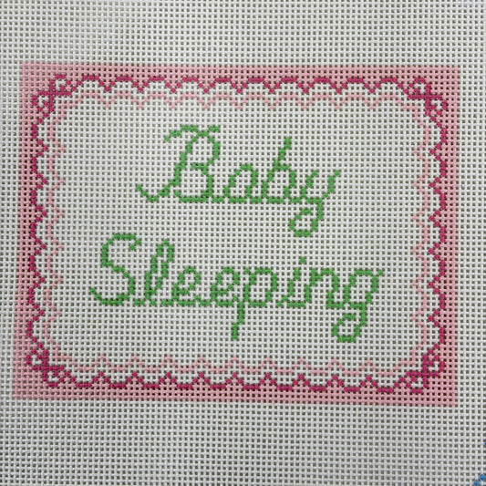 BABY SLEEPING WITH PINK BOWS