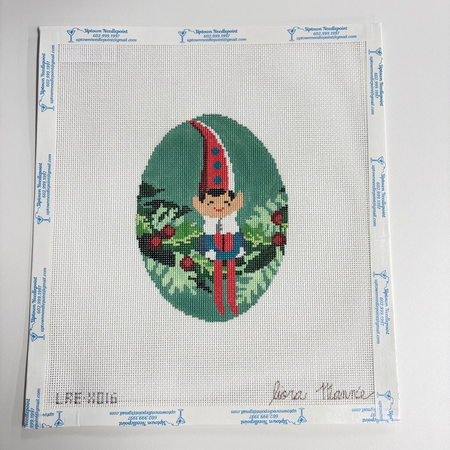 Elf Sitting on Wreath